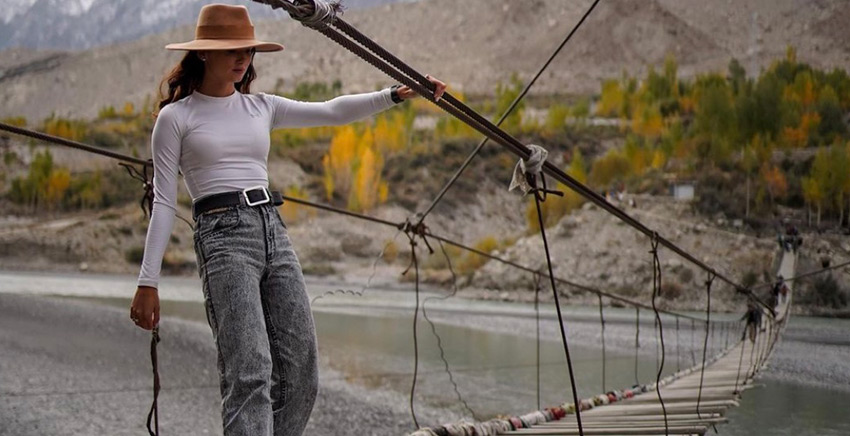 Lady standing on a bridge in Pakistan