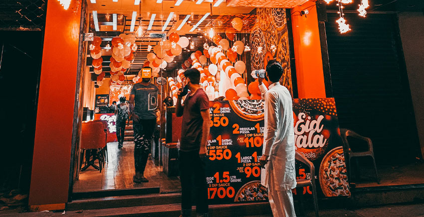 People standing in front of a restuarant