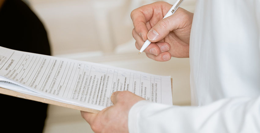 person holding documents